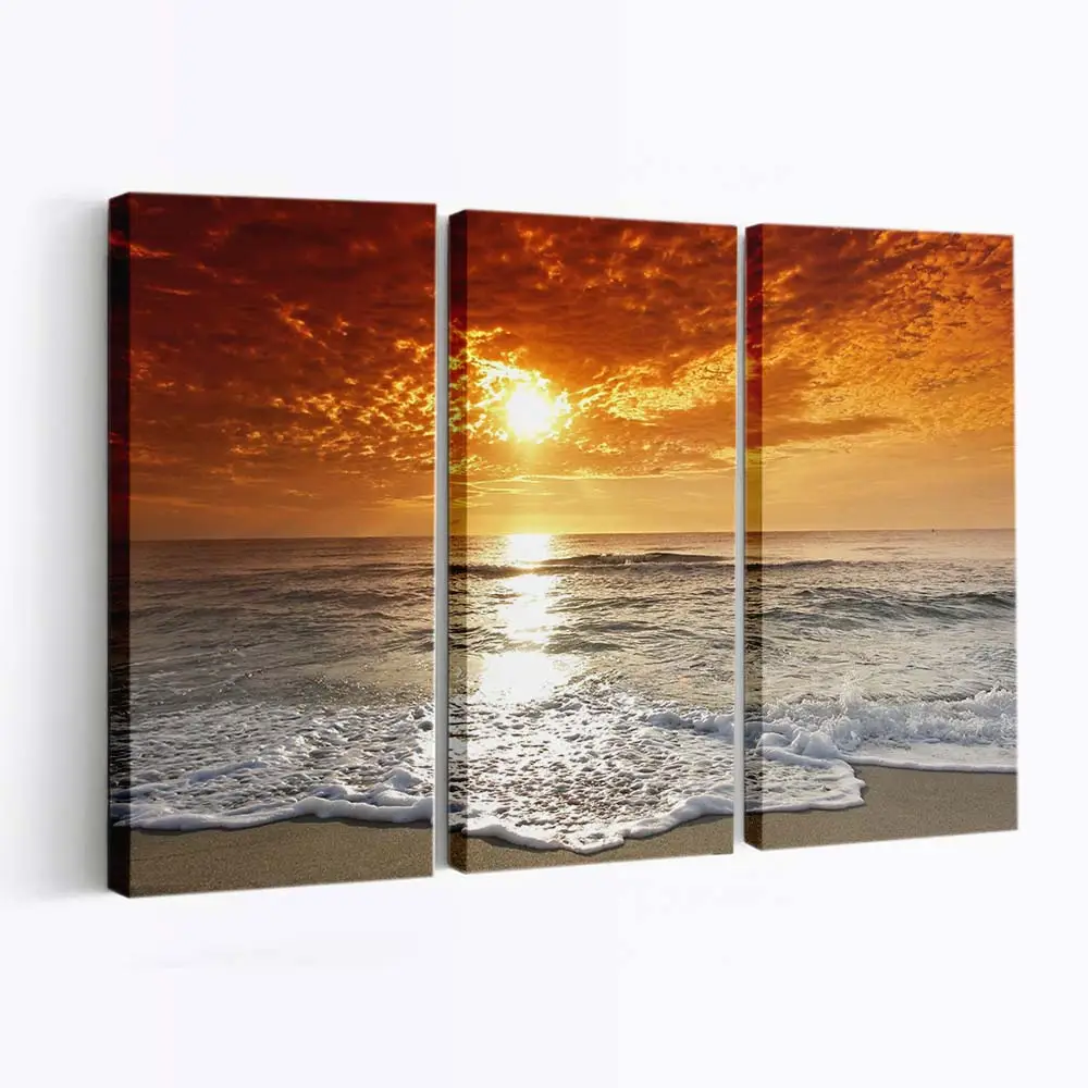 Sonnenuntergang an der Küste mit Goldenem Himmel Leinwandbild