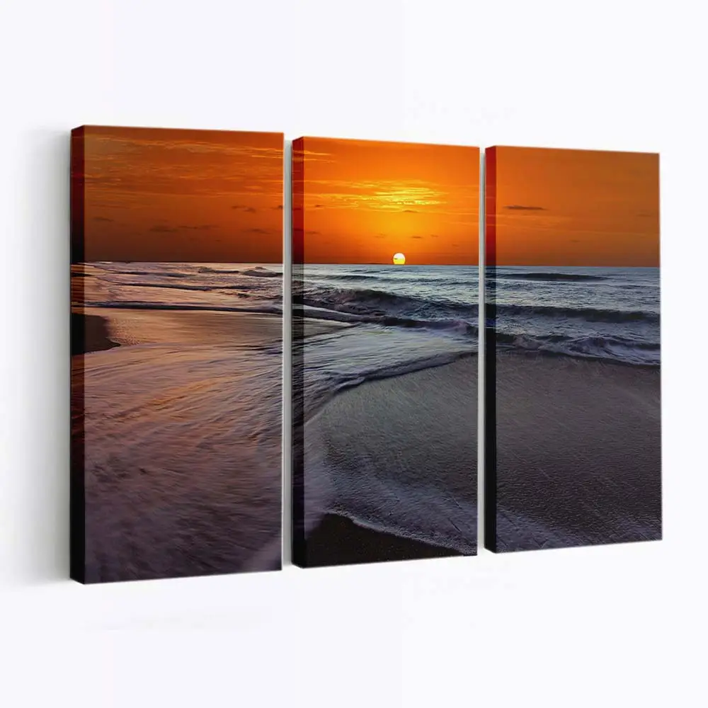 Goldener Sonnenuntergang am Strand Leinwandbild