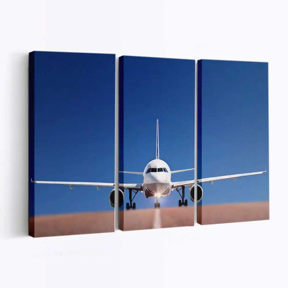 Modernes Flugzeug am blauen Himmel – Flugzeug Leinwandbild